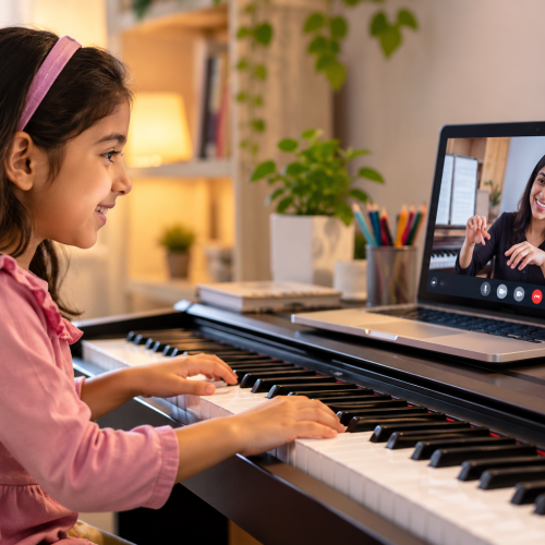 Child taking an online piano lesson